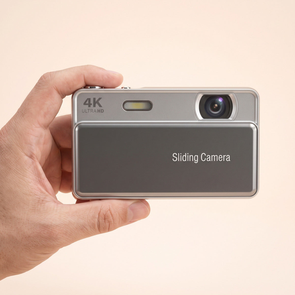 Sliding Camera held in one hand to show its pocket size